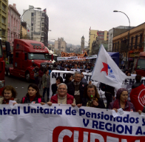 Supporters of striking Chilean dockers parade through the streets.